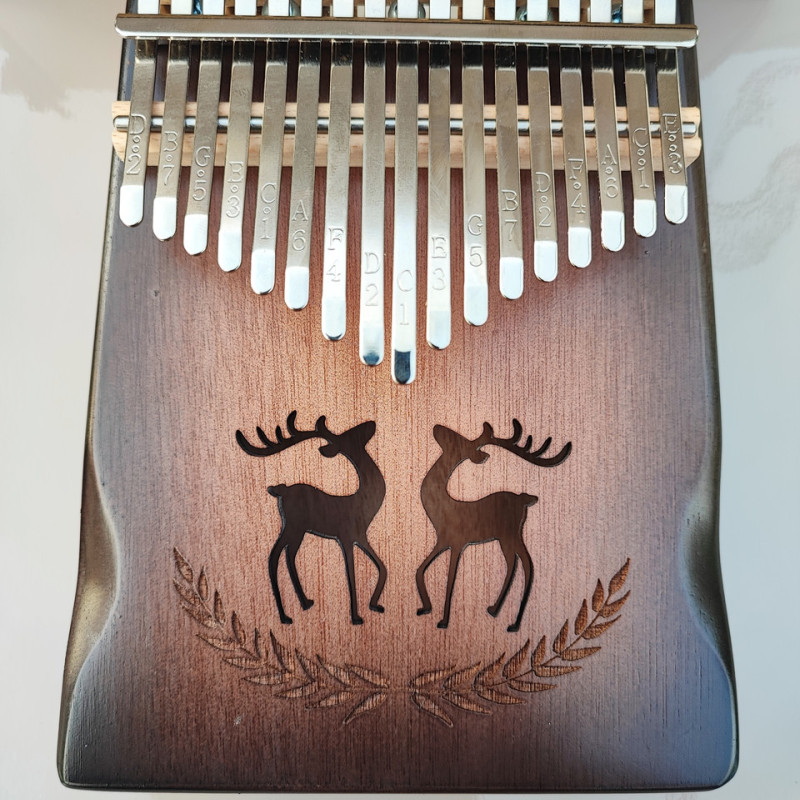 Калімба на 17 язичків (нот), з натурального дерева. З молоточком, чохлом. Коричнева.