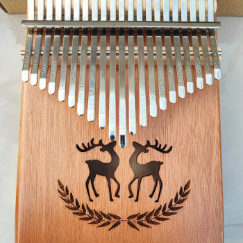 Калімба на 21 язичок (нот) з натурального дерева. З молоточком, чохлом. Коричнева