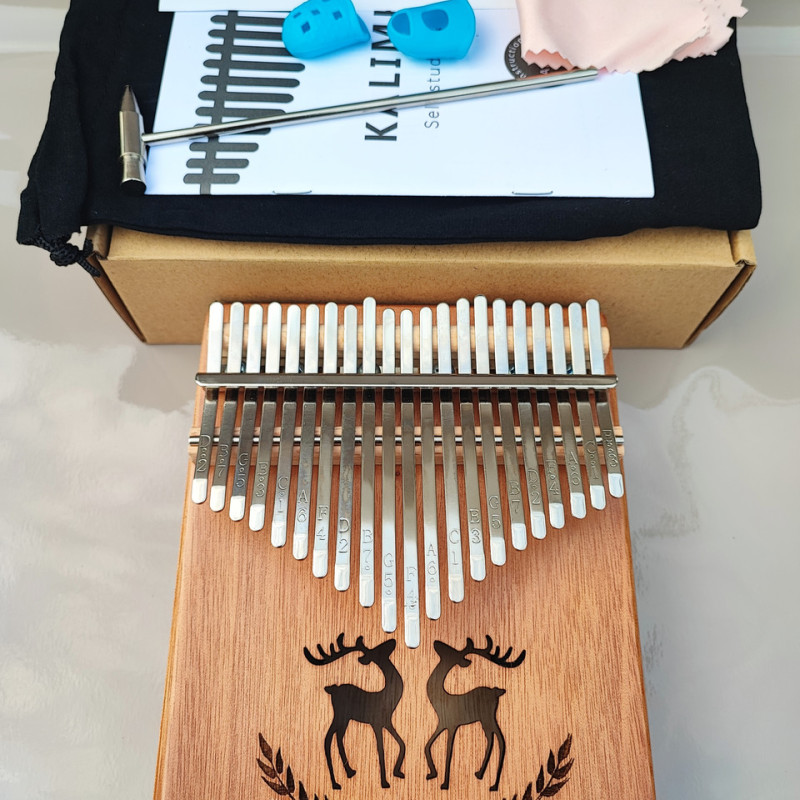 Калімба на 21 язичок (нот) з натурального дерева. З молоточком, чохлом. Коричнева