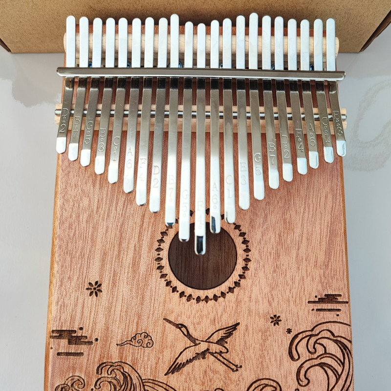 Калімба на 21 язичок (нот) з натурального дерева. З молоточком, чохлом. Коричнева